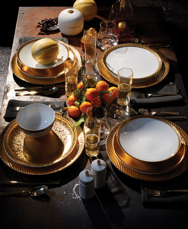 Gold Formal Dinnerware with oranges in a bowl and black napkins