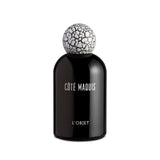 black bell shaped glass bottle with white lettering topped with a round crackle top