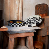 Damier Bowl and Damier Round Platter. Black and white checkerboard glaze pattern on a low, round porcelain platter and flared bowl.