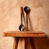 Alhambra Serving Set (2 Piece Set). hand-carved, fine smoked ash serving utencils with brass ring details.