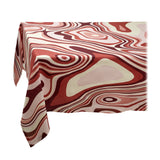 Linen rectangular tablecloth with an organic, undulating pattern in red, pink and ivory hues.