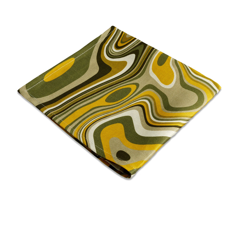 Linen napkins with an organic, psychedelic pattern in muted green, yellow, brown and ivory hues.