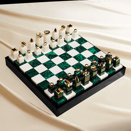 Chess set with green and white pieces on a checkered board