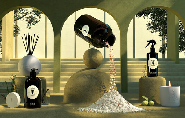 3D illustrated scene depicts surreal, oversized Bois Sauvage apothecary products- lotion, room spray, bath salt and fragrance diffuser.