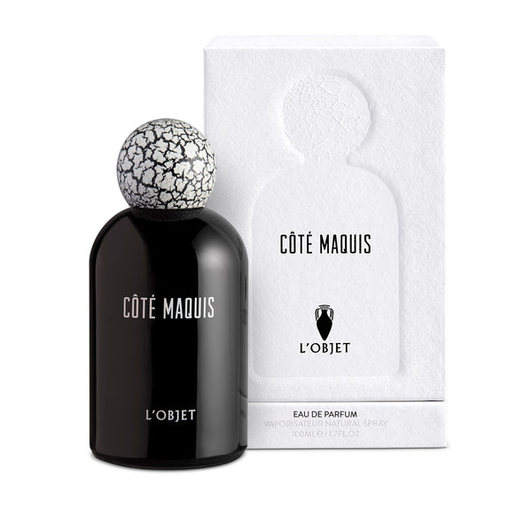 black bell shaped glass bottle with round crackle top in front of a white paper matte packaging box
