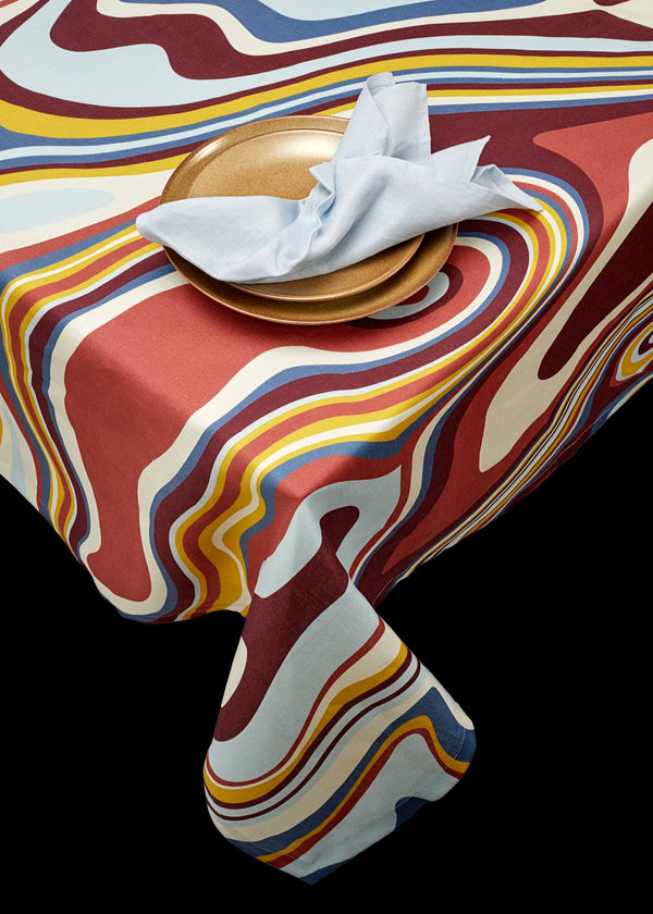 Linen rectangular tablecloth  with an organic, psychedelic pattern in red, blue, yellow and ivory hues.