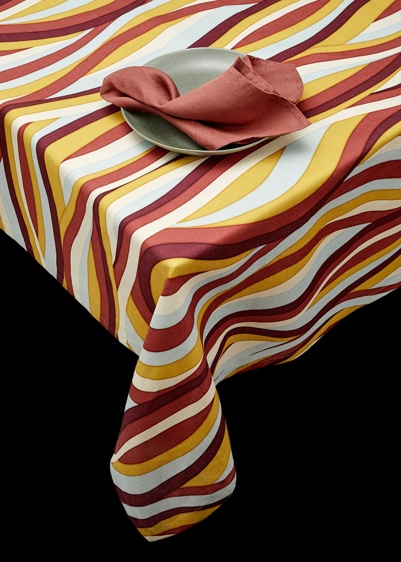 Linen rectangular tablecloth with an organic, undulating pattern in red, burgundy, blue, green and ivory hues.