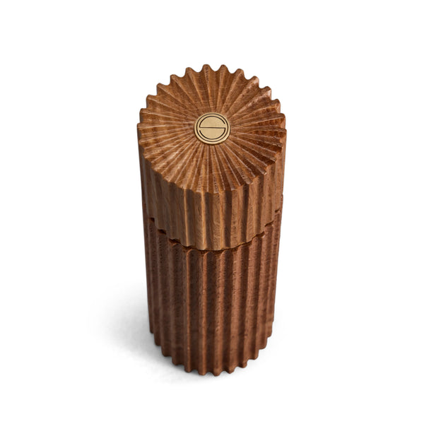 Architectural salt and pepper mills are hand carved in natural European oak with metal grinding mechanism