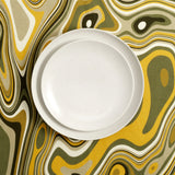 Table set with Linen sateen green and yellow waves tablecloth, Terra stone glazed dinnerware